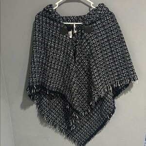 Chic Black and White Poncho has sequins throughout. Very beautiful NWT